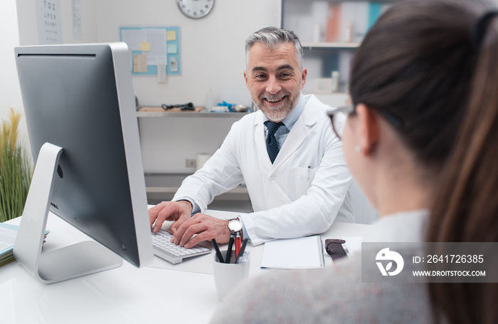 Doctor working with his computer