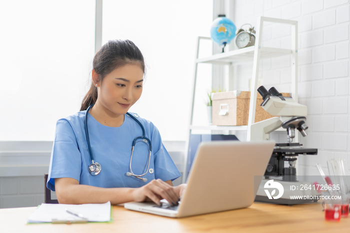 Asian female doctor work at hospital office desk giving patient convenience online service advice, s