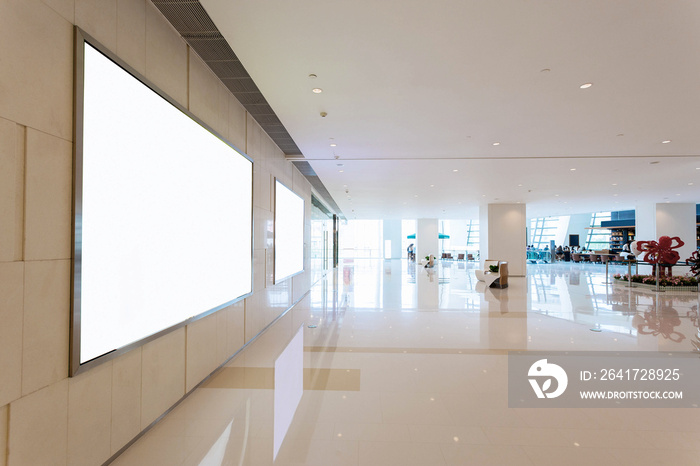 Empty blank billboard in shopping mall interior