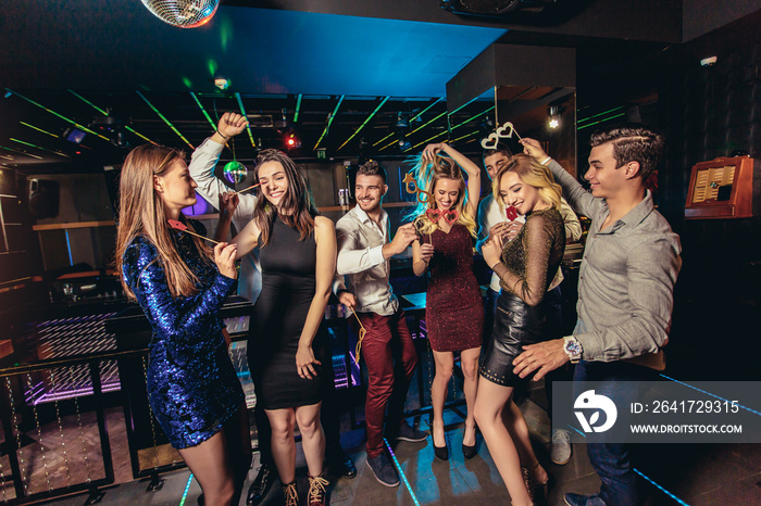 Young people dancing in night club