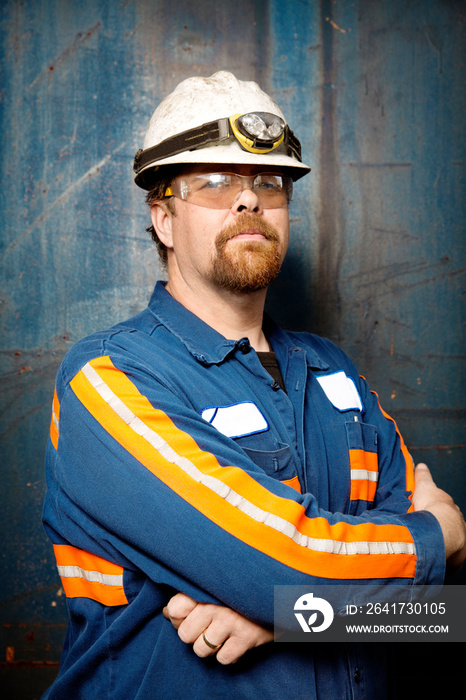 Portrait of industrial worker with arms crossed