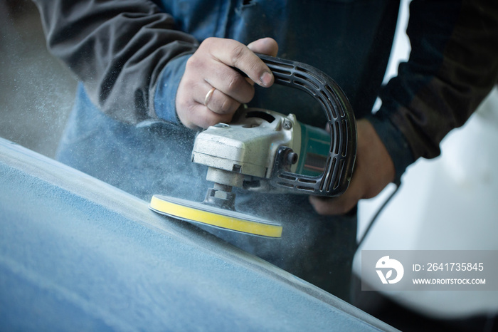 Sanding polishing of the bumper on the car at a hundred close-up