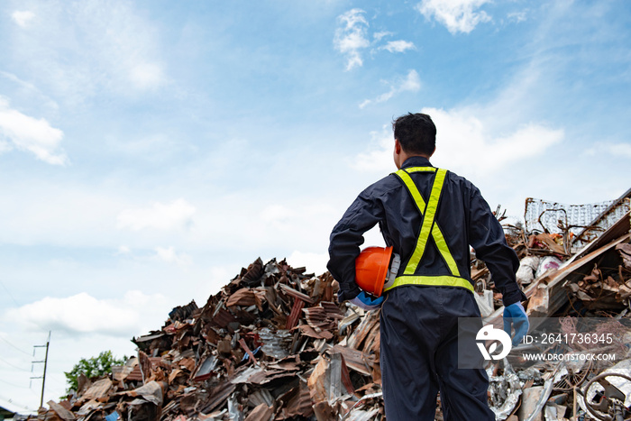 sanitation worker working in recycling plant Staff wearing reflective vests in an industrial interio