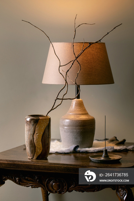 Home interior with beige handcrafted ceramic vase