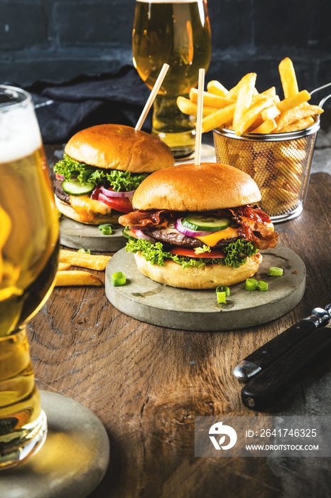 Beef burger with fries and a refreshing pint of craft beer