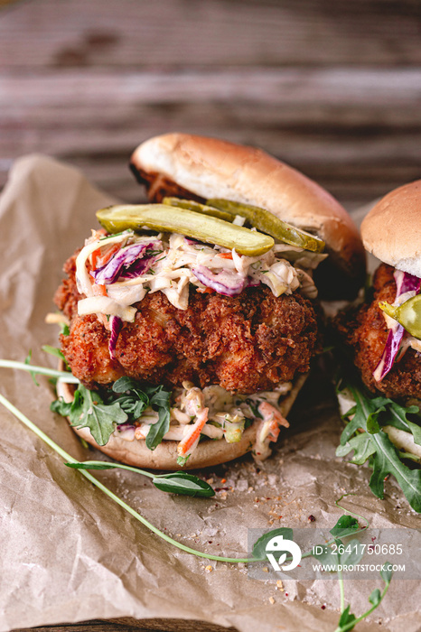 Spicy southern style fried chicken sandwich with coleslaw and pickles. Toasted burger buns. Fast foo