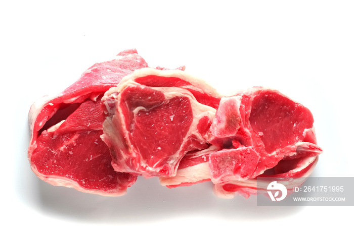 Three fresh raw lamb loin chops on a white background, isolated. Meat industry.