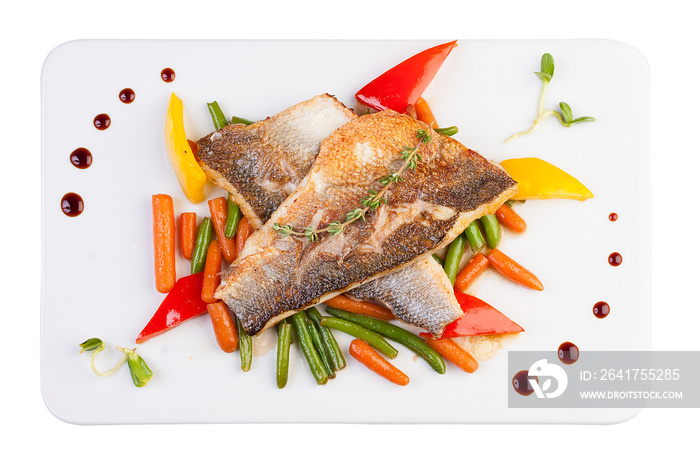 Fillet of sea bass on the vegetables. On white background