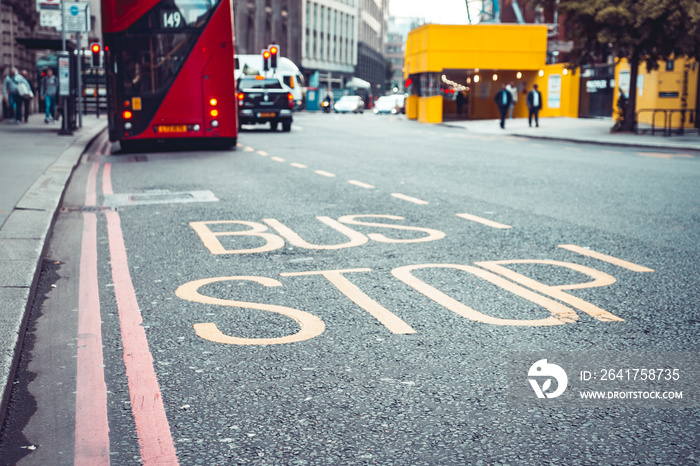 Bus top sing on the road in London