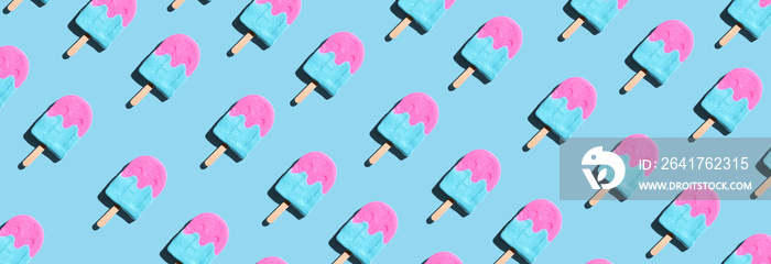 Pink and blue popsicles with shadow - overhead view