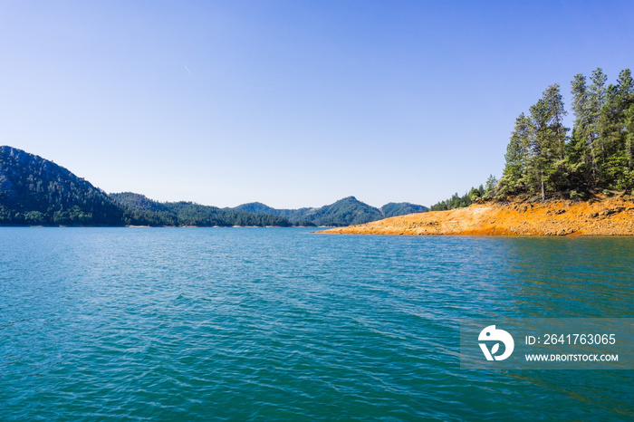 Shasta Lake, McCloud River Arm landscape on a sunny summer morning, Northern California