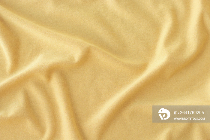 Creased yellow cloth material as a background