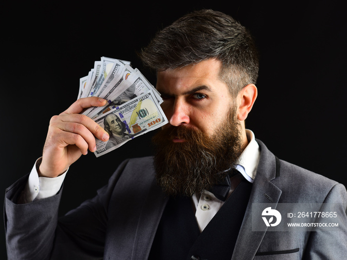 Wealthy and confident. Bearded man with dollar banknotes. Successful businessman hold cash money. Ri