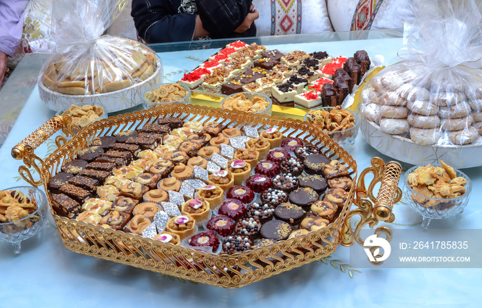 Traditional Moroccan festive cookies on silver tray, view from above. Ramadan cookies ready for eati