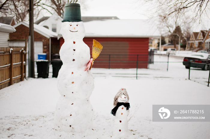 Snowmen on snow field during winter