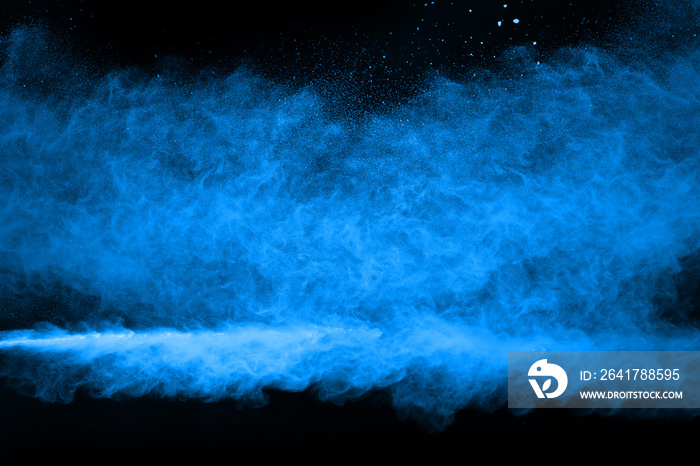 abstract blue powder splatted background,Freeze motion of color powder exploding/throwing color powd