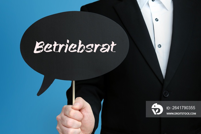 Betriebsrat. Geschäftsmann hält Sprechblase in der Hand. Wort/Text auf Schild.