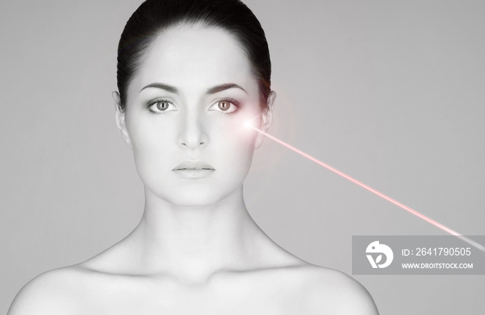 Removing birthmarks with a laser ray. Beautiful face of a young woman.