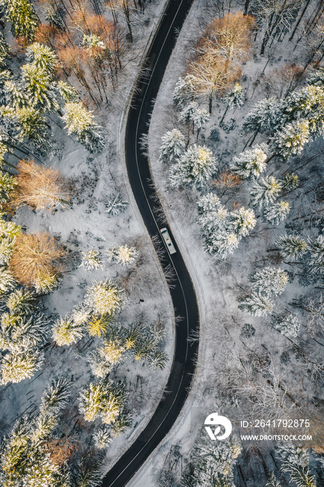 Truck on road after a heavy snowfall in mid winter season