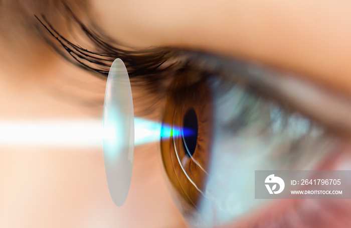 Young girl having eye test eye test machine