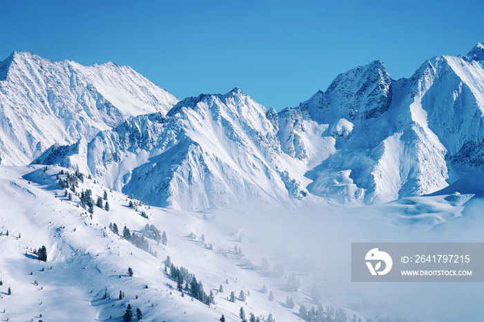 Landscape in Zillertal Arena ski resort in clouds in Tyrol at Mayrhofen in Austria in winter Alps. A