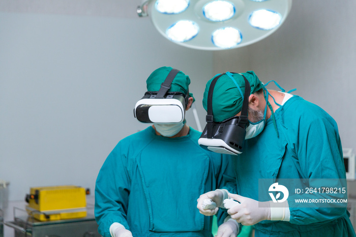 Doctor surgeon wearing virtual reality glasses. The surgeon is doing surgery by inserting a camera a