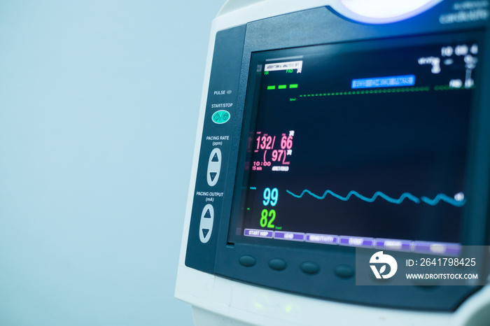 EKG monitor at ICU in hospital blue filter with copy space.