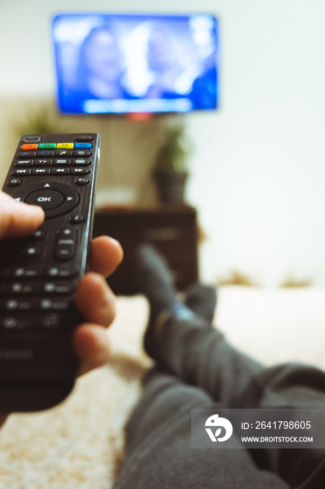 hand holding tv remote close-up