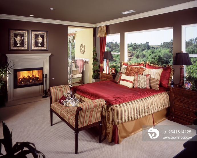 Pillows and cushions arranged on bed in contemporary bedroom