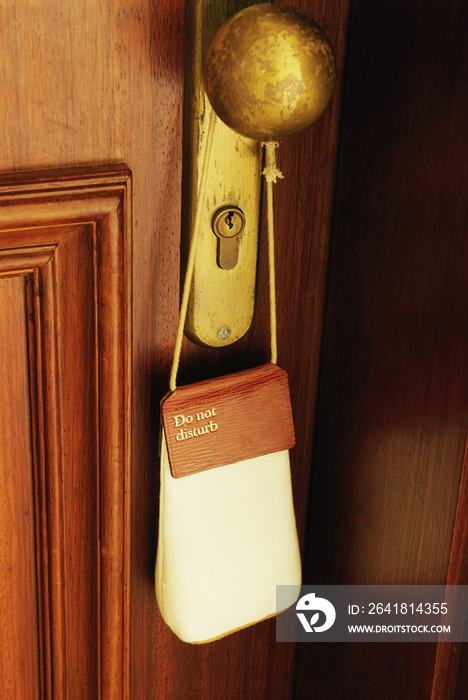 Do not disturb sign hanging from hotel door handle, Africa