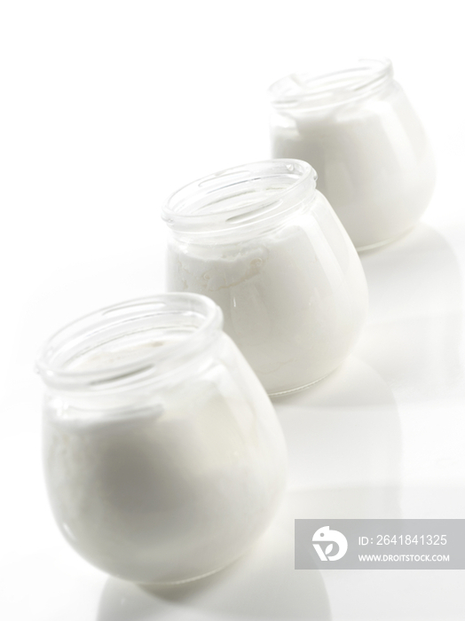 Yoghurt jars in a row 