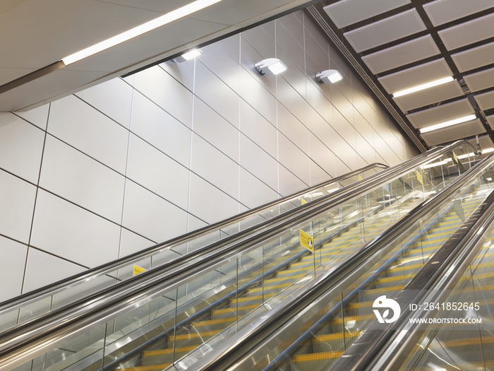 Low angle view of cropped escalator at an underpass