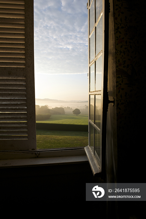 Countryside through window