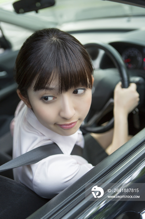 Young woman driving a car