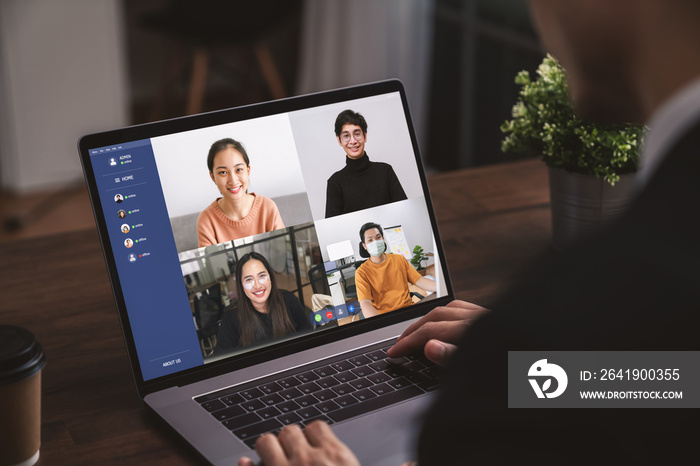 Businessman using laptop on table with making video call meeting to team online and present work pro