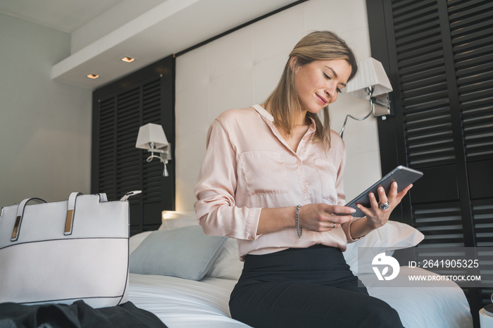 businesswoman working on her digital tablet.