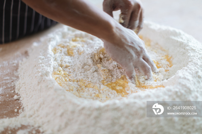 Making Handmade Noodles on wood background