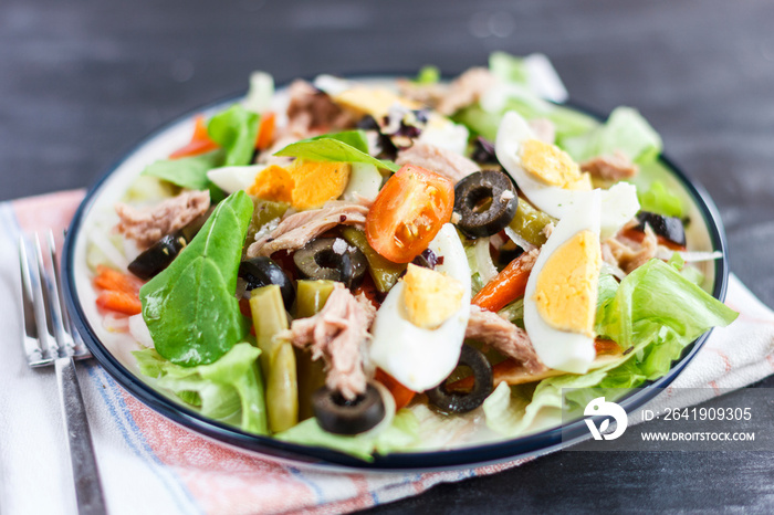 Nicoise salad with tuna, green beans, basil and fresh vegetables