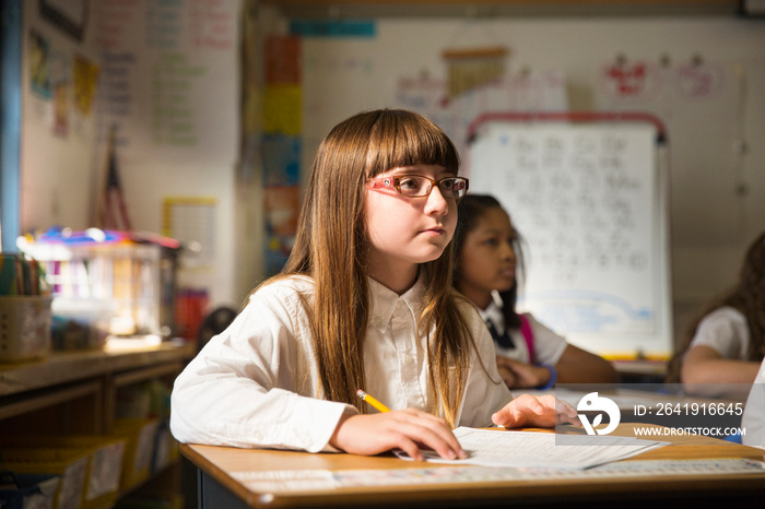 Student sitting at desk in classroom