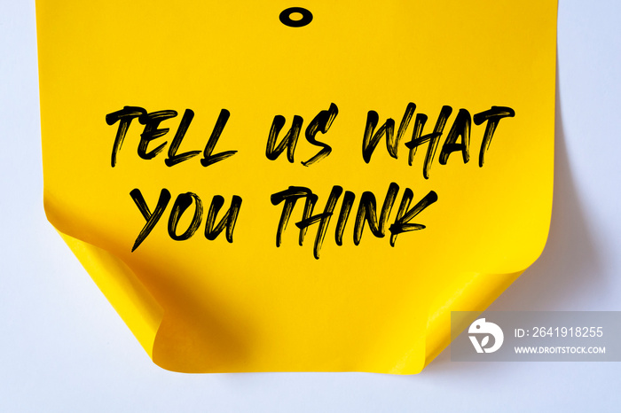 Tell Us What You Think write on Sticky Notes.