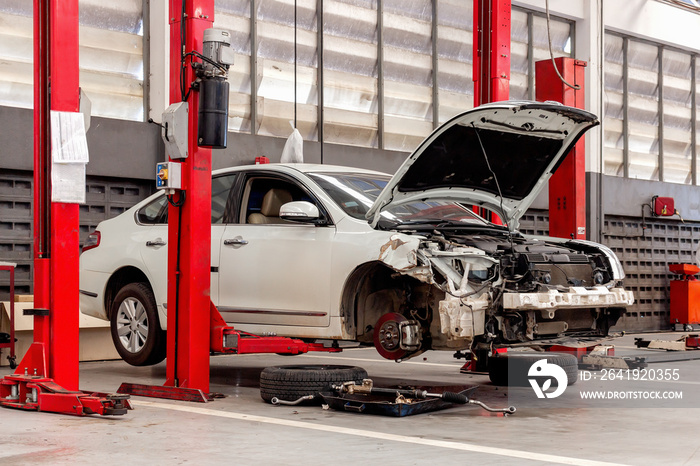 closeup car in repair station and body shop with soft-focus and over light in the background