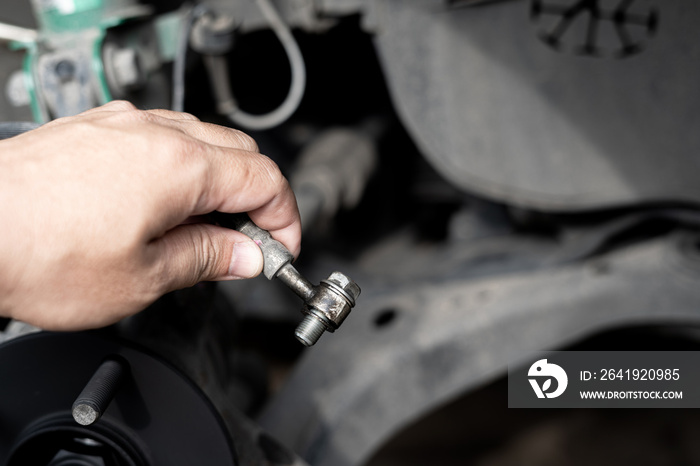 Technician remove Brake hose from brake caliper of the car in system check