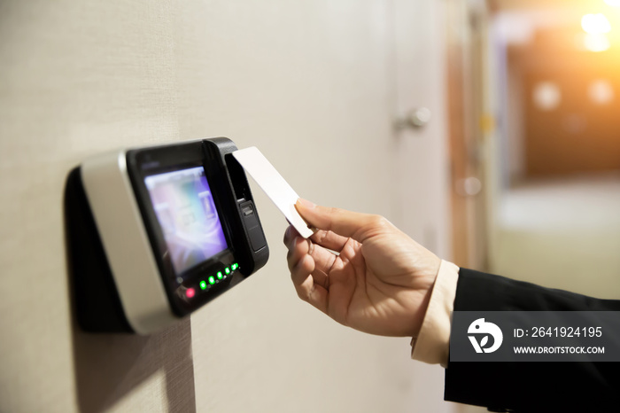 Close-up Of Hand Businessman Using Keycard To Open Door.