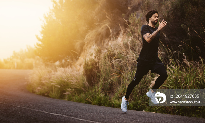 Man running fast on mountain road