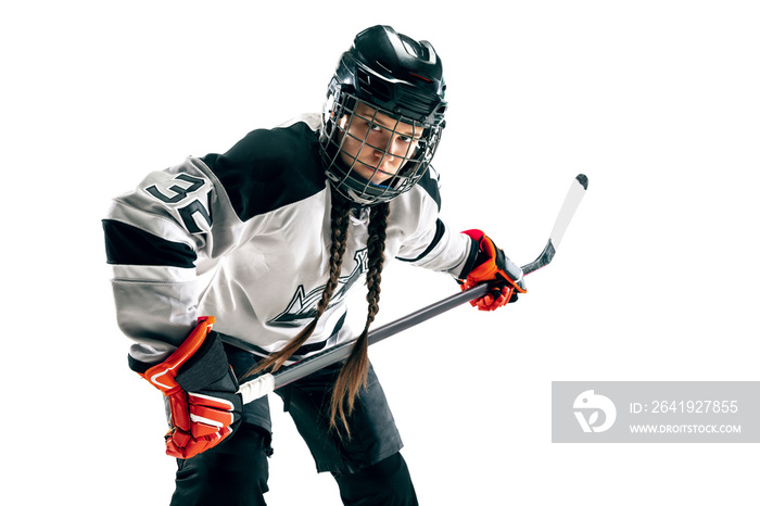 Young female hockey player isolated on white background. Sportswoman wearing equipment and helmet st