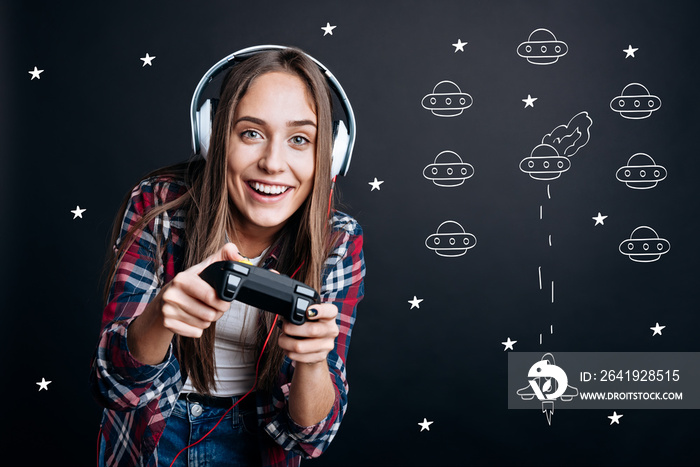 Cheerful delighted woman playing video games