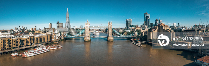 Arial view of London with the River Thames near Tower Bridge, the Shard and Canary Wharf district at