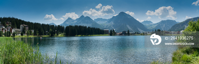panorama landscape view of the lake and town of Arosa in the Swiss Alps