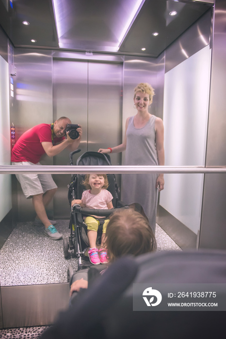 happy family in the elevator