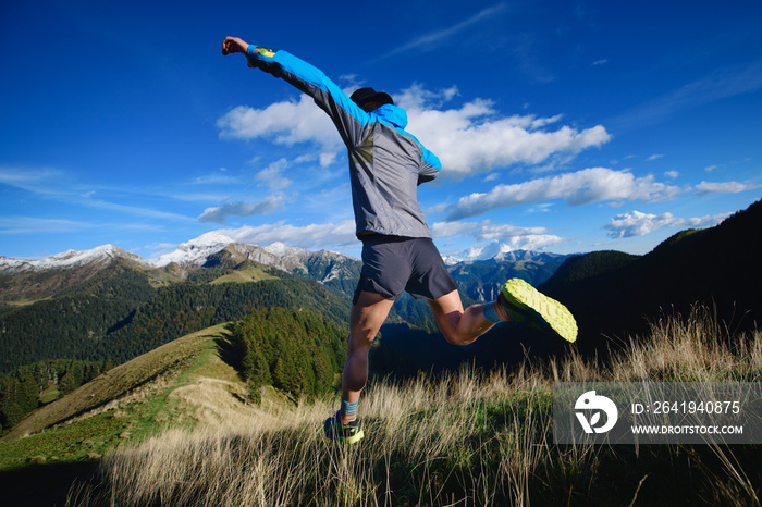 Downhill race on mountain terrain an athlete during a workout